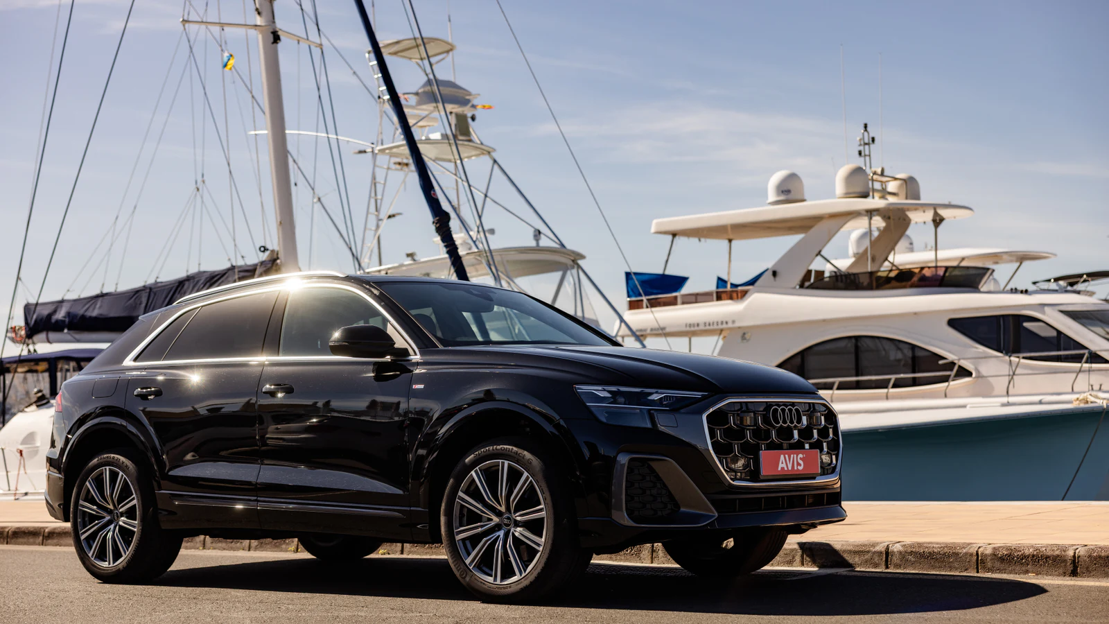 Avis SUV photographed beside a Tenerife marina