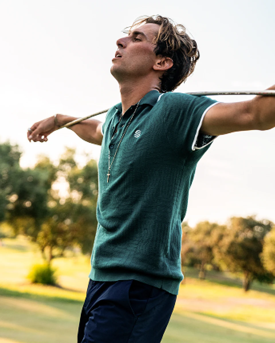 Golfer wearing a teal Siroko knit polo on the course