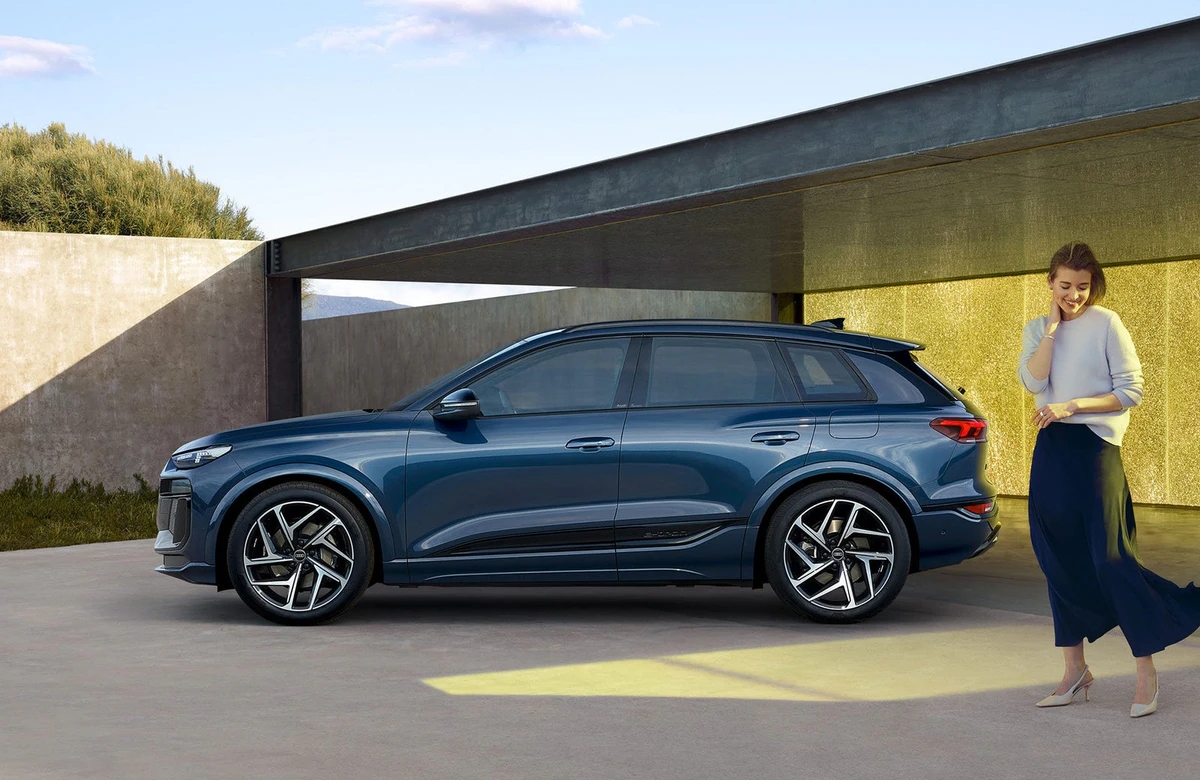 Blue Audi Q6 e-tron parked outside a modern building