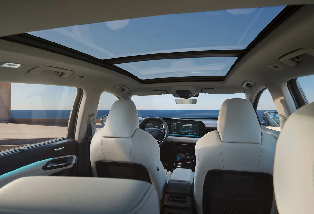 Audi Q6 e-tron cabin with panoramic roof and digital displays